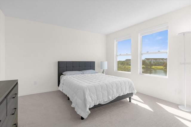 bedroom with light colored carpet