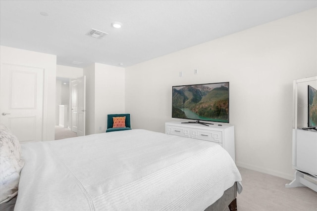 bedroom with light colored carpet