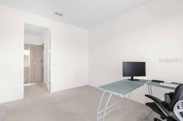 office area with light colored carpet