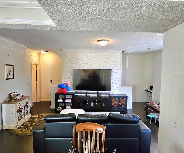 living room with a textured ceiling and ornamental molding