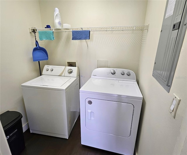 washroom with dark hardwood / wood-style floors, separate washer and dryer, and electric panel