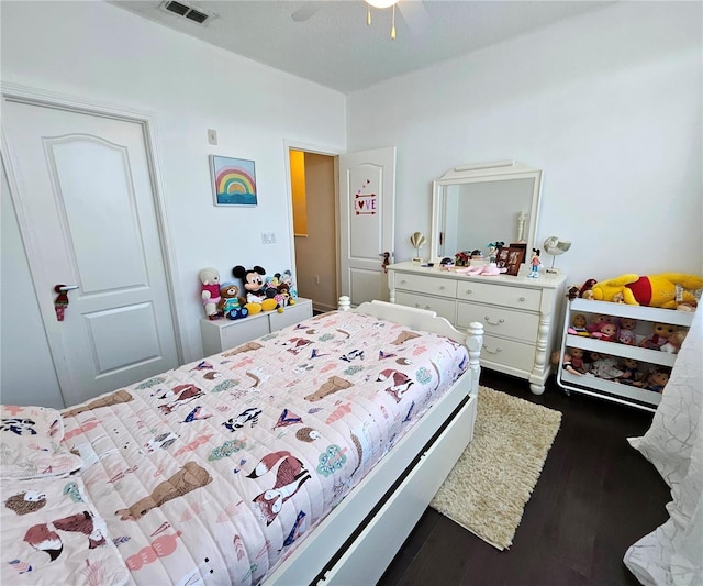 bedroom featuring ceiling fan and dark wood-type flooring