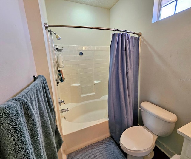 bathroom with toilet and shower / bath combo with shower curtain