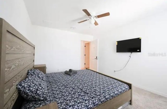 bedroom with light colored carpet and ceiling fan