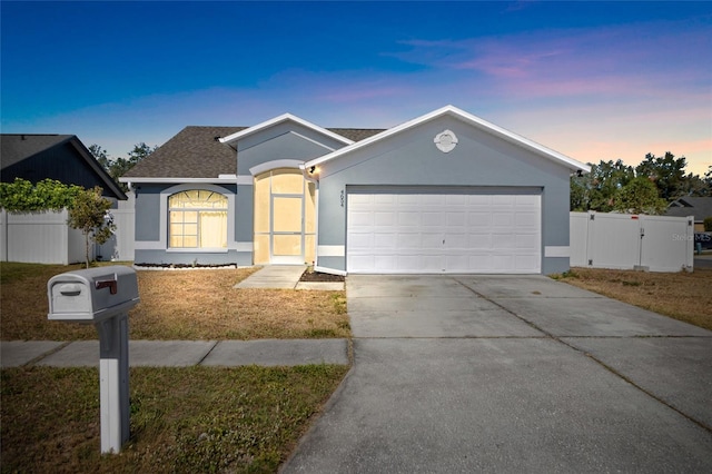 ranch-style home featuring a garage