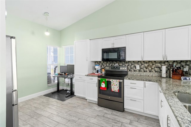 kitchen with decorative backsplash, white cabinetry, lofted ceiling, and appliances with stainless steel finishes