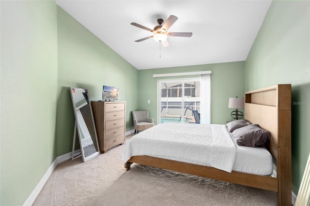 bedroom featuring carpet flooring, ceiling fan, and vaulted ceiling