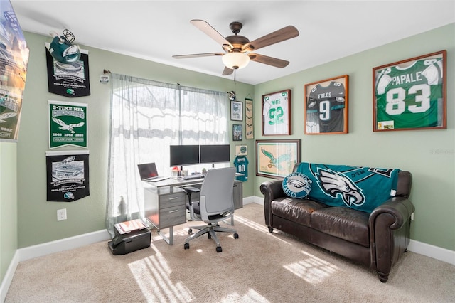 carpeted home office with ceiling fan