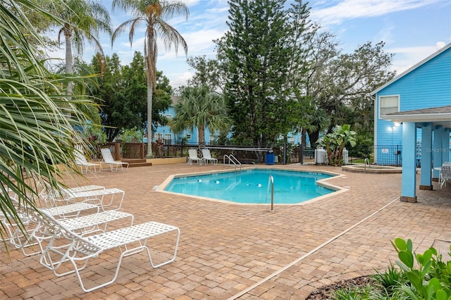 view of swimming pool with a patio