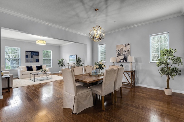 dining area featuring dark hardwood / wood-style flooring, crown molding, and plenty of natural light