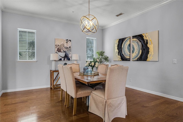 dining space featuring crown molding, dark hardwood / wood-style flooring, and a notable chandelier