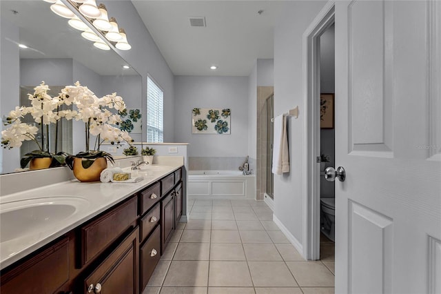 full bathroom with separate shower and tub, tile patterned flooring, vanity, and toilet