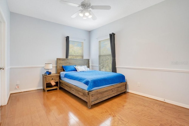 bedroom featuring hardwood / wood-style flooring and ceiling fan