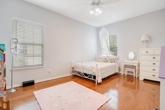 bedroom with ceiling fan and hardwood / wood-style flooring