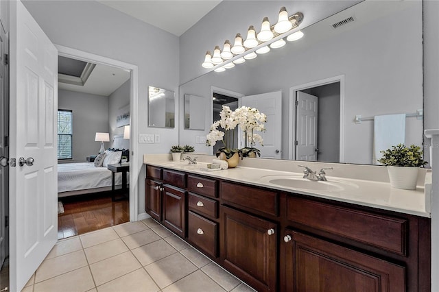 bathroom with vanity and hardwood / wood-style flooring