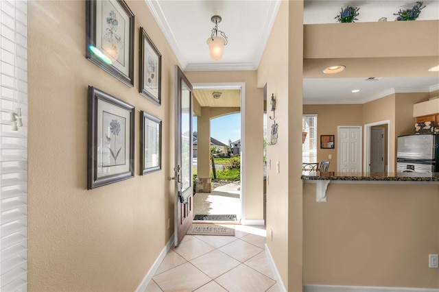 interior space featuring light tile patterned floors and ornamental molding