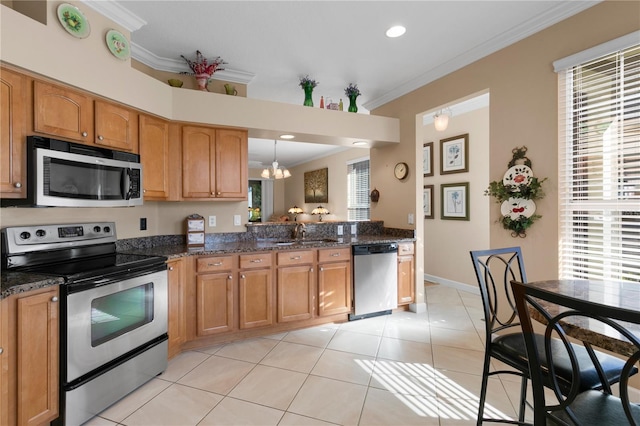 kitchen with ornamental molding, appliances with stainless steel finishes, light tile patterned floors, and a sink