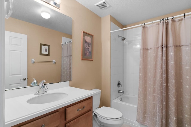 full bath featuring visible vents, toilet, vanity, shower / bath combination with curtain, and a textured ceiling