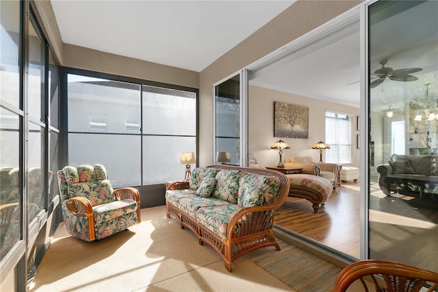 sunroom with a ceiling fan