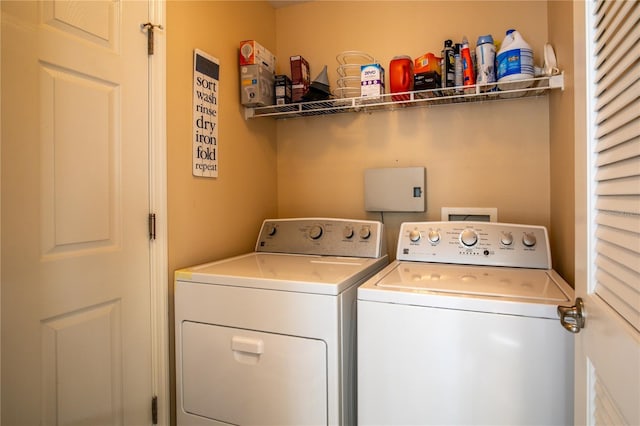 washroom featuring laundry area and independent washer and dryer