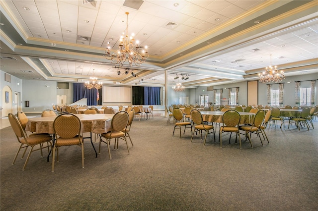 carpeted dining space featuring crown molding, a tray ceiling, visible vents, and an inviting chandelier