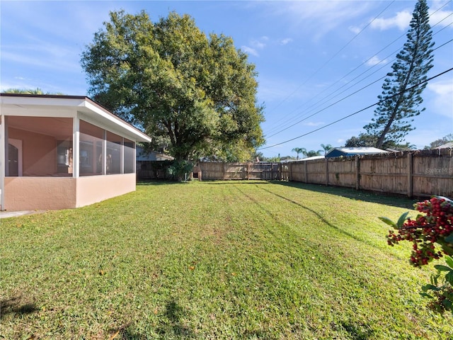 view of yard featuring a sunroom