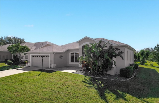 view of front of house with a garage and a front lawn