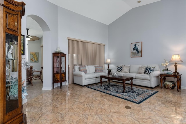 living room with high vaulted ceiling