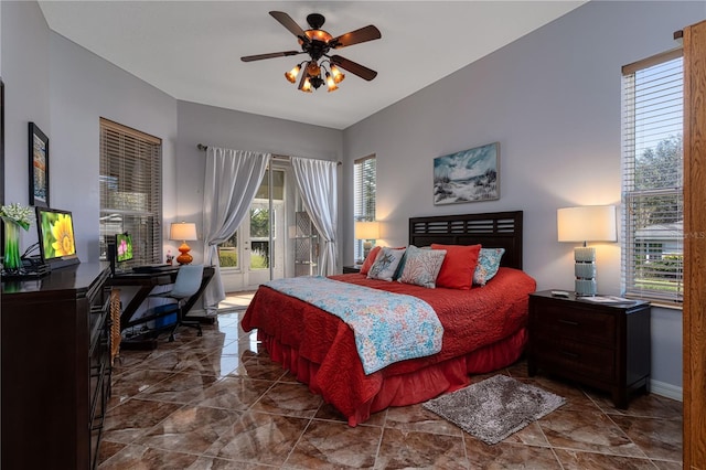 bedroom with ceiling fan and multiple windows