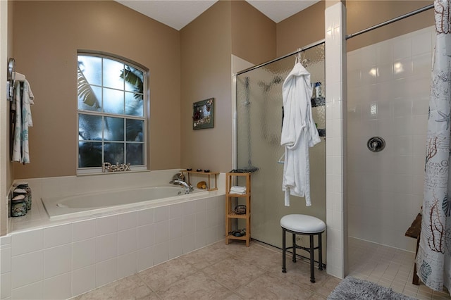 bathroom with plus walk in shower and tile patterned flooring