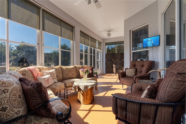 sunroom featuring ceiling fan