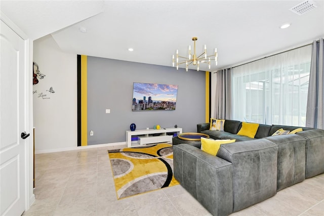 living room with light tile patterned floors and an inviting chandelier