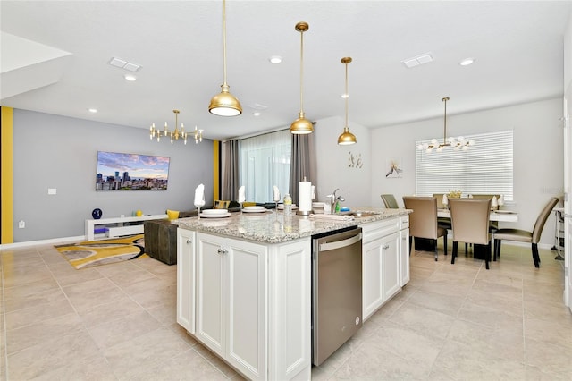 kitchen featuring pendant lighting, an island with sink, and stainless steel dishwasher