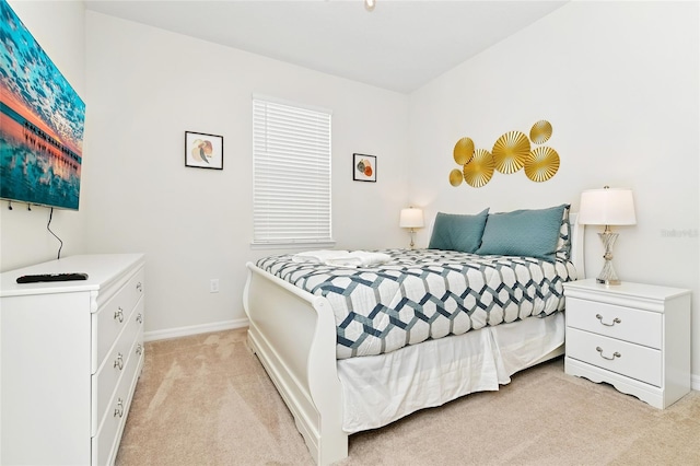 bedroom with light carpet