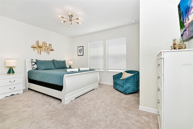 carpeted bedroom featuring a chandelier