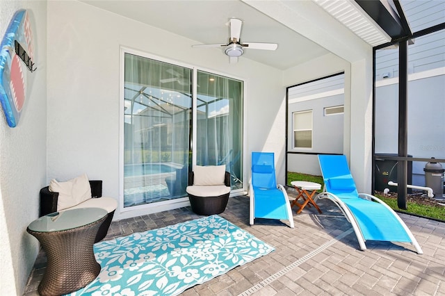 view of patio featuring ceiling fan