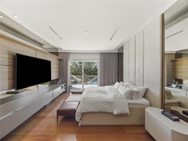 bedroom with wood-type flooring