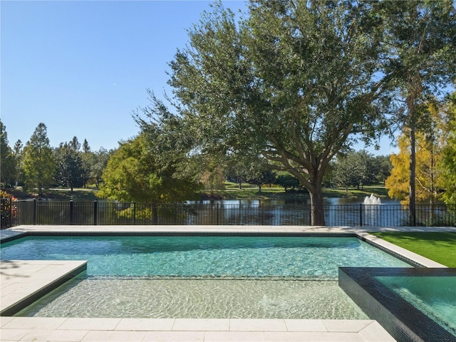 view of pool featuring an in ground hot tub and a water view