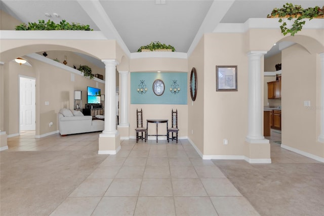 carpeted entryway featuring a towering ceiling