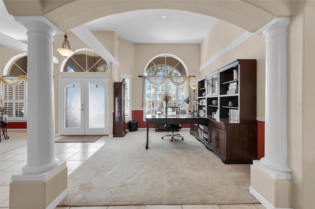 home office with french doors and light colored carpet