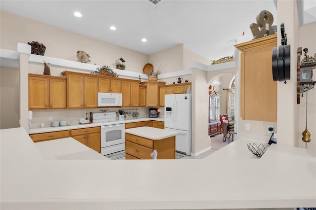 kitchen with white appliances and kitchen peninsula