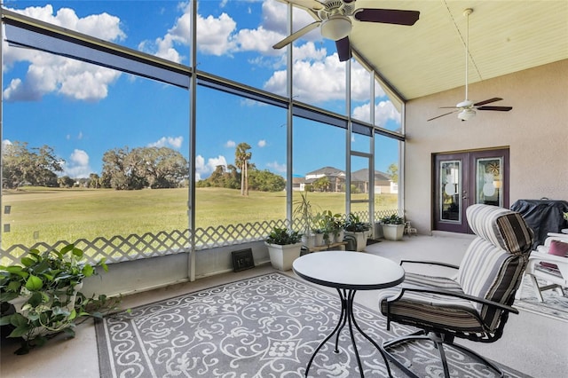 sunroom featuring ceiling fan