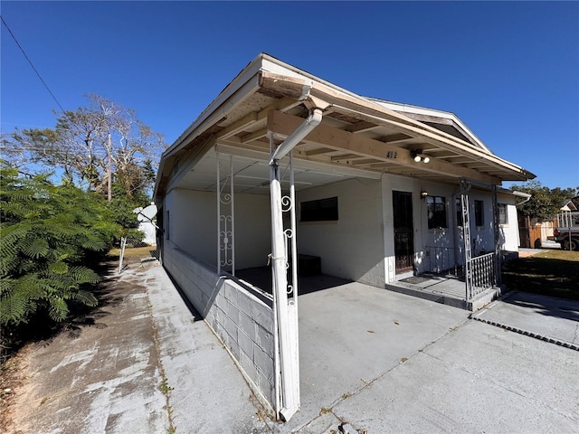 view of side of home featuring a carport