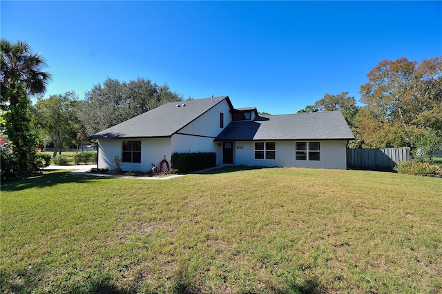 back of house featuring a yard