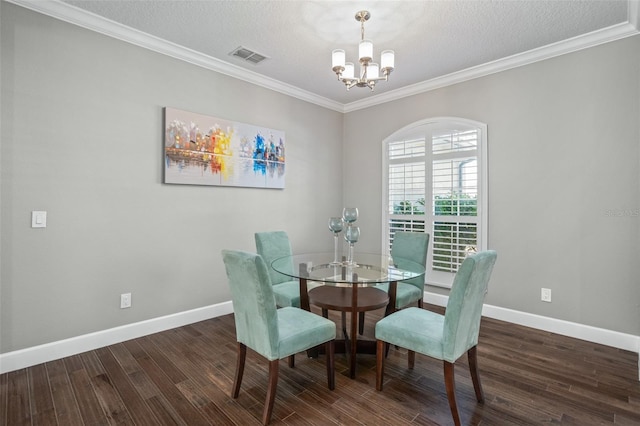 dining room with a notable chandelier, dark hardwood / wood-style floors, ornamental molding, and a textured ceiling