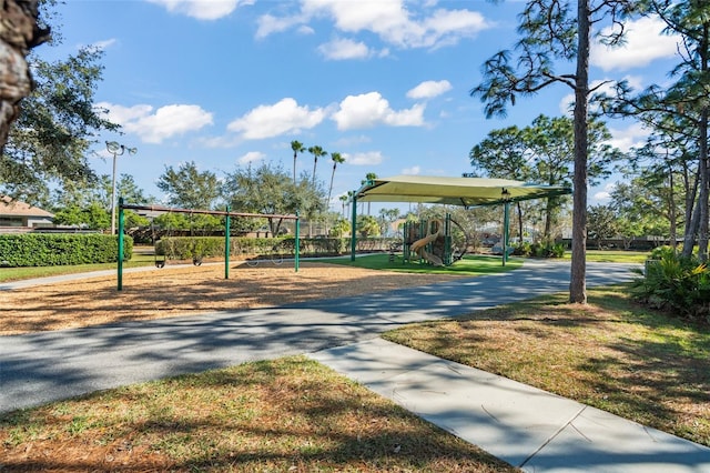 view of property's community with a playground