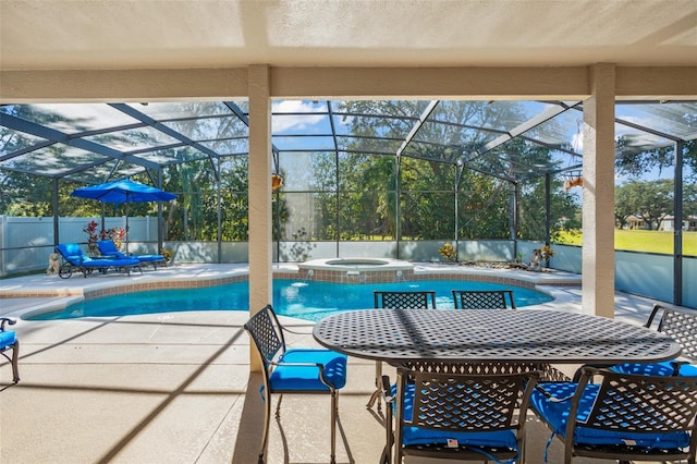 view of swimming pool with a lanai, an in ground hot tub, and a patio