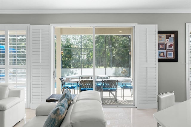 living room with ornamental molding and a healthy amount of sunlight