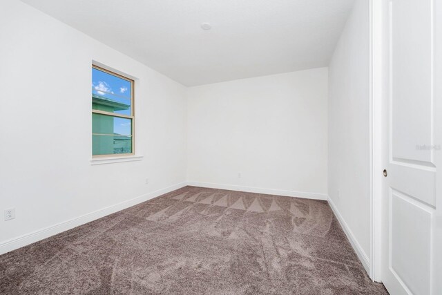 unfurnished room featuring carpet floors