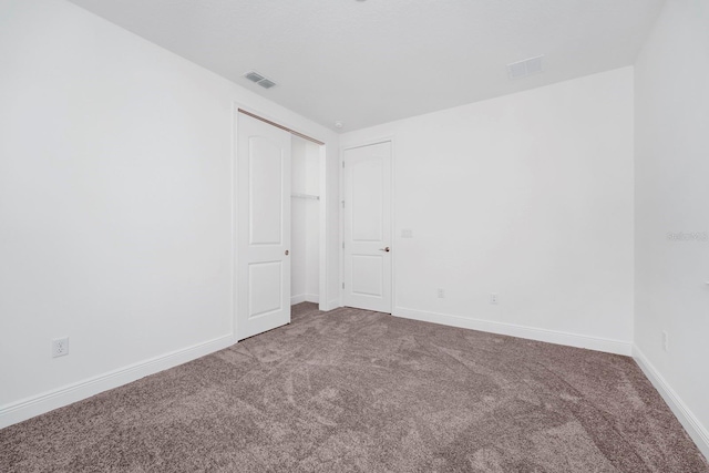 unfurnished room with carpet floors